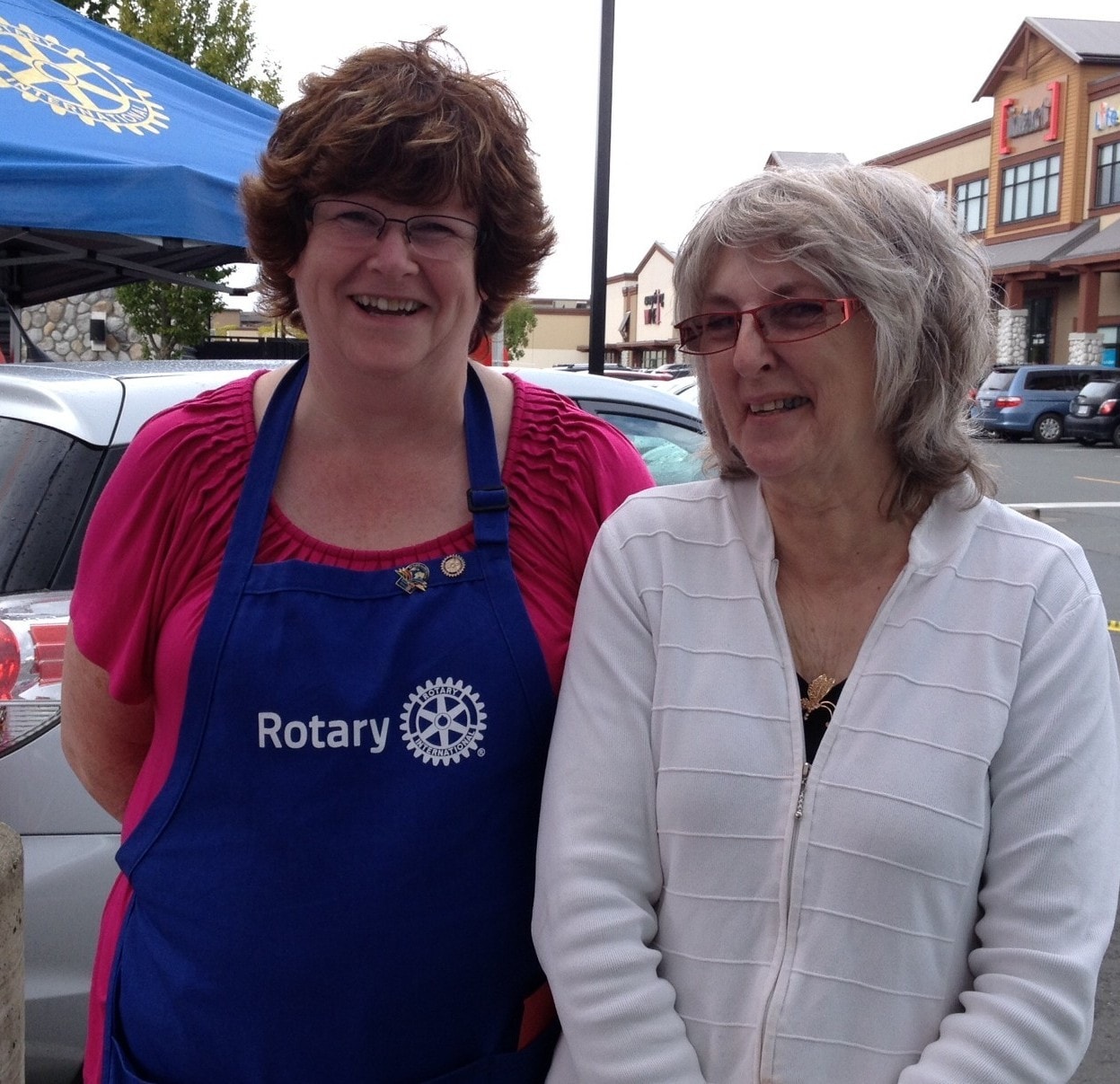 Mentors fundraising and volunteering at a Rotary club barbecue